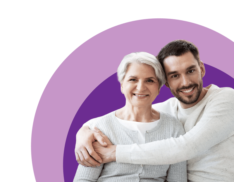 Caregiver and senior embracing